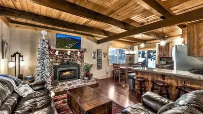 a living room with a couch and a fireplace at COH0809 - Brule Haven home in South Lake Tahoe