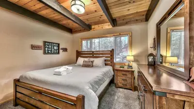 a bedroom with a bed and a desk and a window at COH0809 - Brule Haven home in South Lake Tahoe