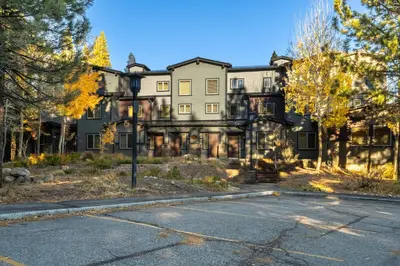 a large house with a street in front of it at Mammoth Green #220 - Nearly Ski-In Ski-Out 3 Bedroom 2 Bath, Sleeps 8 in Mammoth Lakes