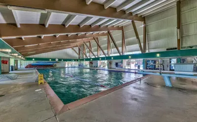 a large swimming pool in a large building at Tahoe Keys Studio Condo in South Lake Tahoe