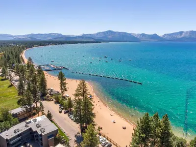 an aerial view of a beach with boats in the water at Tahoe Classic Cabin Near the Beach in South Lake Tahoe