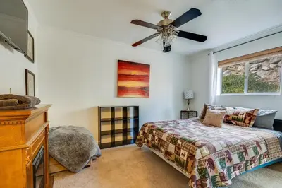 a bedroom with a bed and a ceiling fan at Quaking Aspen Condo in Stateline
