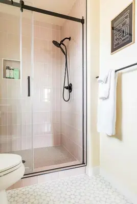 a bathroom with a shower with a toilet at Huth Street Haven in Lake Isabella