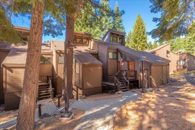 a house with a lot of trees in front of it at Indian Hills 6021 townhouse in Truckee