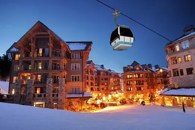 a gondola is flying over a city with buildings at Indian Hills 6021 townhouse in Truckee