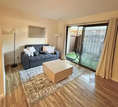 a living room with a couch and a coffee table at Near Lake, Golf and Tennis - Reno Condo in Reno