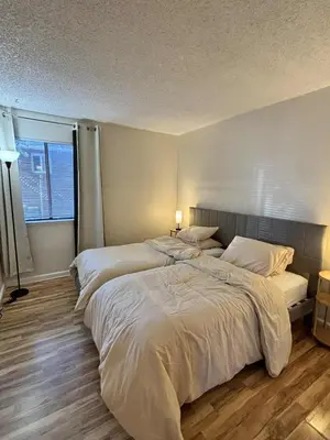 a bedroom with two beds and a window at Near Lake, Golf and Tennis - Reno Condo in Reno
