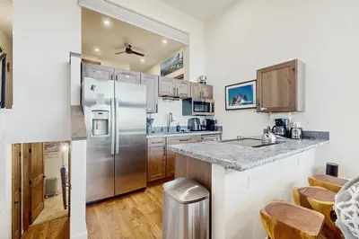 a kitchen with stainless steel appliances and wooden cabinets at Lakeview Landing in Stateline