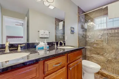 a bathroom with two sinks and a toilet at South Lake Tahoe Charm in South Lake Tahoe