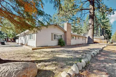 a house with a tree in front of it at South Lake Tahoe Charm in South Lake Tahoe