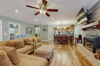 a living room with a couch and a ceiling fan at South Lake Tahoe Charm in South Lake Tahoe