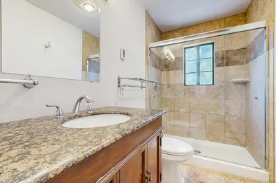 a bathroom with a sink and a toilet and a shower at Serene Road Lodge in Soda Springs