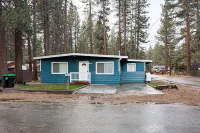 a blue house in the middle of a parking lot at Sierra Pines Retreat Tahoe in South Lake Tahoe