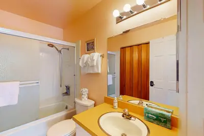 a bathroom with a sink and a toilet and a shower at Chateau Sans Nom 38 in Mammoth Lakes