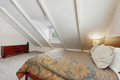 a bedroom with a large bed in an attic at Meyers Tahoe Escape in South Lake Tahoe