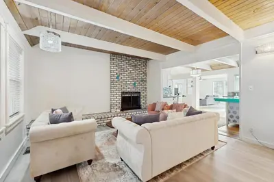 a living room with two couches and a fireplace at Meyers Tahoe Escape in South Lake Tahoe