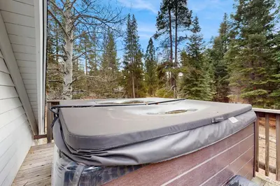 a suitcase sitting on a deck on a porch at Meyers Tahoe Escape in South Lake Tahoe