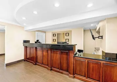 a large kitchen with a bar in a room at Aurora Inn in Modesto