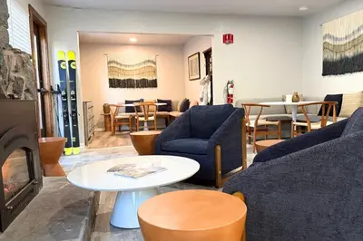 a living room with a couch and chairs and a table at The Iceberg Tahoe in South Lake Tahoe