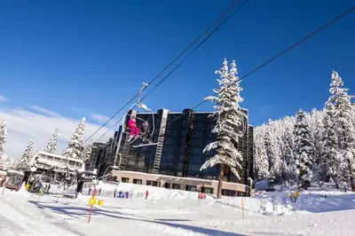 a person is on a ski lift in the snow at Remodeled Second Floor Valley View suite in Olympic Valley