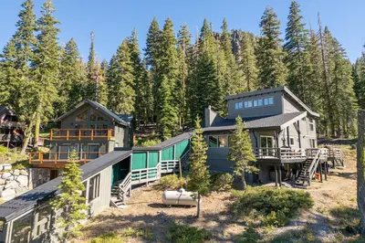 an aerial view of a house in the woods at Panoramic Peaks at Alpine by Tahoe Getaways - Pet Friendly, AC, Hot Tub, Shuttle & Stunning Views in Alpine Meadows