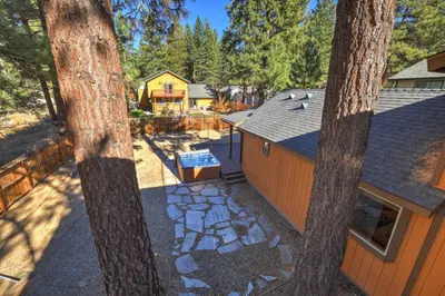 an overhead view of a backyard with a house and trees at Knotty by Nature 3 bed home in South Lake Tahoe