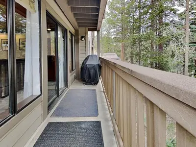 a bag of luggage sitting on the porch of a house at Slopeside Condo With Fireplace Snowbird 112 At 1849 Condos in Mammoth Lakes