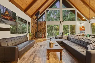 a large living room with couches and a table at 
