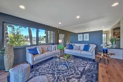 a living room with two couches and a table at 2030 Marconi Way home in South Lake Tahoe