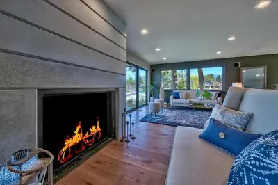 a living room with a fireplace and a couch at 2030 Marconi Way home in South Lake Tahoe