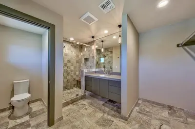 a bathroom with a toilet and a sink at 2030 Marconi Way home in South Lake Tahoe