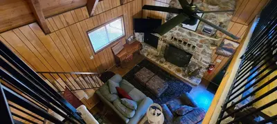 an overhead view of a living room with a fireplace at Lakeview Lodge, bookable boat slip! in Bass Lake