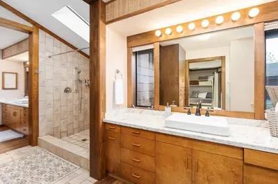 a bathroom with a sink and a shower at Mountain Oasis-Indoor Hot Tub, Game Room, VIEWS in Oakhurst