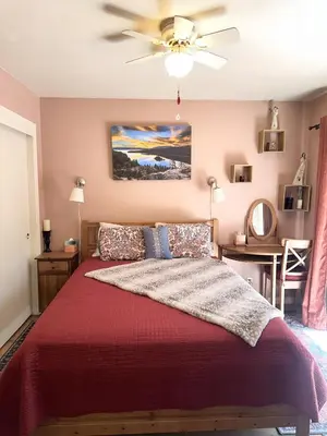 a bedroom with a bed and a ceiling fan at CYH0822 - Pinter Pines Retreat home in South Lake Tahoe