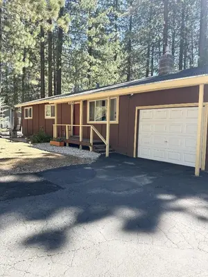 a house with a garage and a driveway at CYH0822 - Pinter Pines Retreat home in South Lake Tahoe
