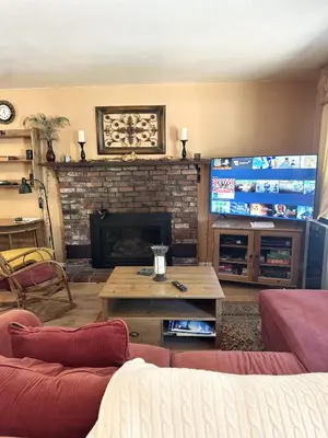 a living room with a couch and a fireplace at CYH0822 - Pinter Pines Retreat home in South Lake Tahoe