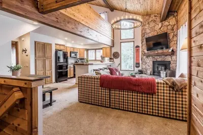 a living room with a couch and a fireplace at Spacious 3BD & Loft Villa - Convenient to Slopes in Mammoth Lakes