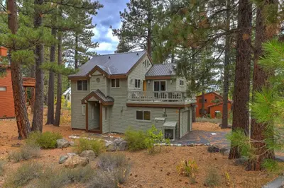a house in the middle of the forest at Woodlands House home in Truckee