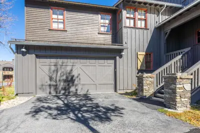 a house with a garage and a driveway at Lodges 1178 - Timber Lodge Retreat in Mammoth Lakes