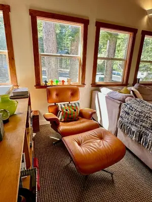 a living room with a leather chair and a couch at Tahoe Park HOA l Palisades l Hot Tub l Dogs OK in Tahoe City