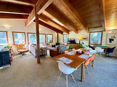 a large living room with a table and chairs at Tahoe Park HOA l Palisades l Hot Tub l Dogs OK in Tahoe City