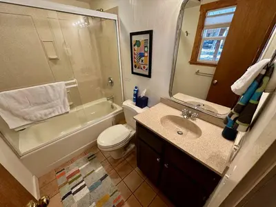 a bathroom with a sink and a toilet and a shower at Tahoe Park HOA l Palisades l Hot Tub l Dogs OK in Tahoe City