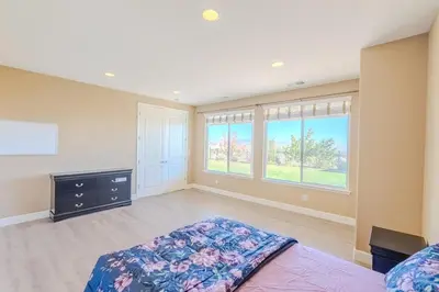 a bedroom with a bed and a large window at Sierra Vista Retreat - Reno Tahoe in Reno