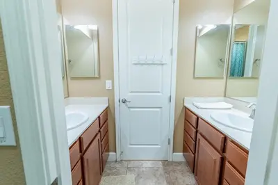 a bathroom with two sinks and two mirrors at Sierra Vista Retreat - Reno Tahoe in Reno