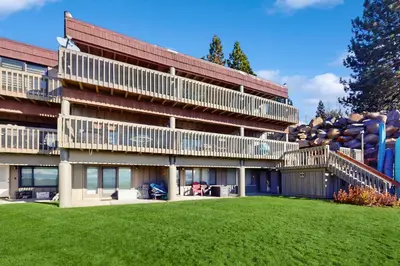a building with a large lawn in front of it at Summit & Shore Chalet in Tahoe Vista