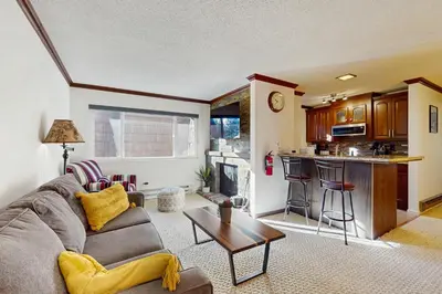 a living room with a couch and a table at Summit & Shore Chalet in Tahoe Vista