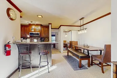 a kitchen and dining room with a table and chairs at Summit & Shore Chalet in Tahoe Vista