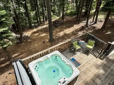 a hot tub on a deck in the woods at Palisades, Lake Tahoe, Tahoe City, Hot Tub, Dogs OK in Tahoe City
