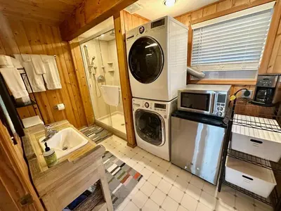 a kitchen with a washer and a sink and a washing machine at Palisades, Lake Tahoe, Tahoe City, Hot Tub, Dogs OK in Tahoe City