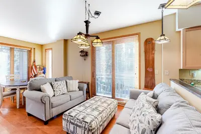 a living room with two couches and a table at Mammoth Green 116 in Mammoth Lakes